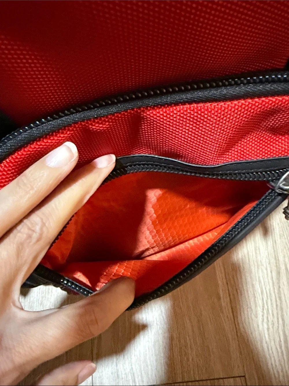 Tumi Red and Black Men/Women’s Backpack with Multiple Front Pockets